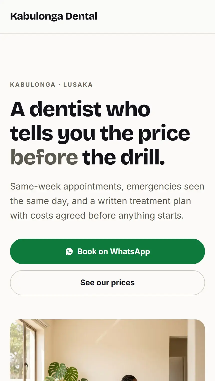 The Kabulonga Dental website on a phone.